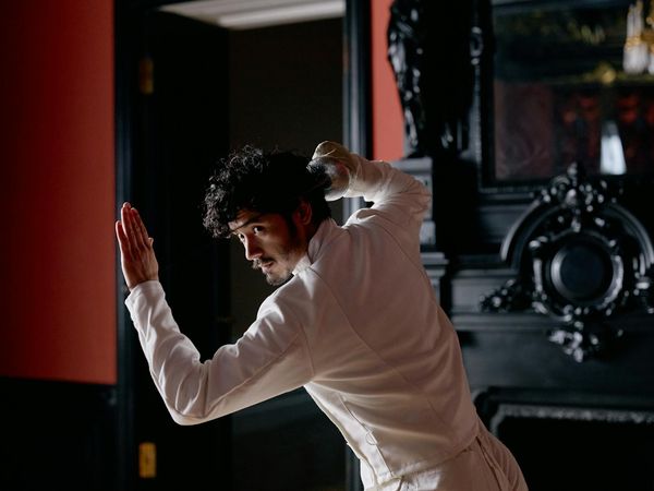 Man in sports gear focusing during a balance training session